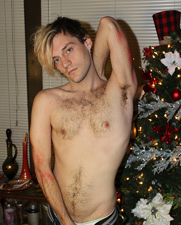 A Christmas Twink Unwraps His Package Under the Tree