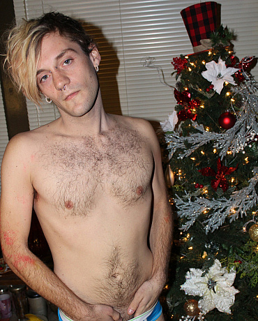 A Christmas Twink Unwraps His Package Under the Tree